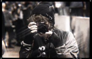 A woman taking a picture with a camera.