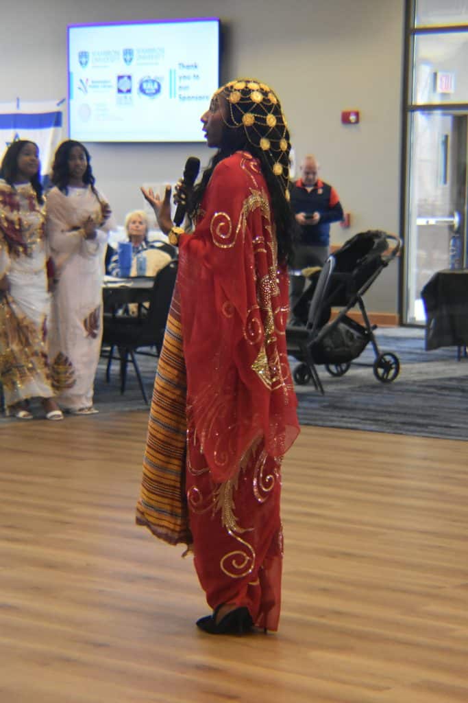 Woman in cultural dress, speaking