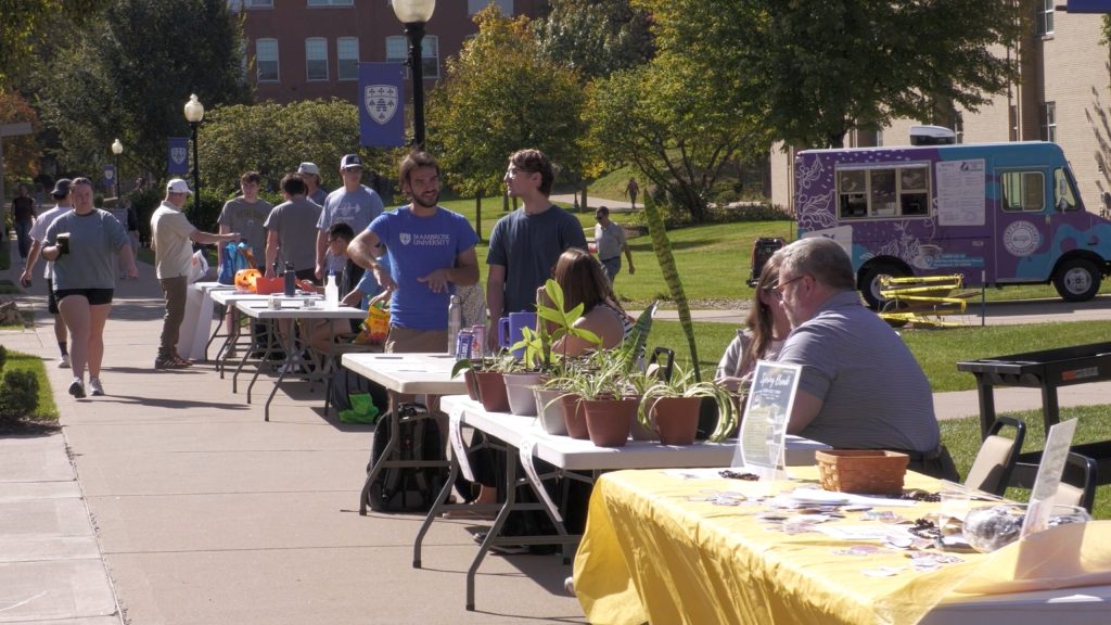 Students and staff at SAU participating in sustainability activities outdoors during the fest.